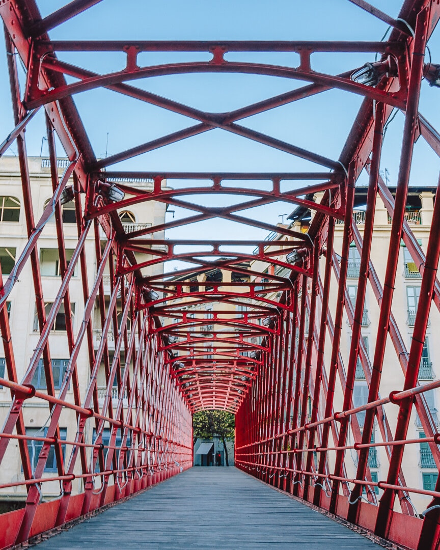 View of the red iron bridge in Girona Spain