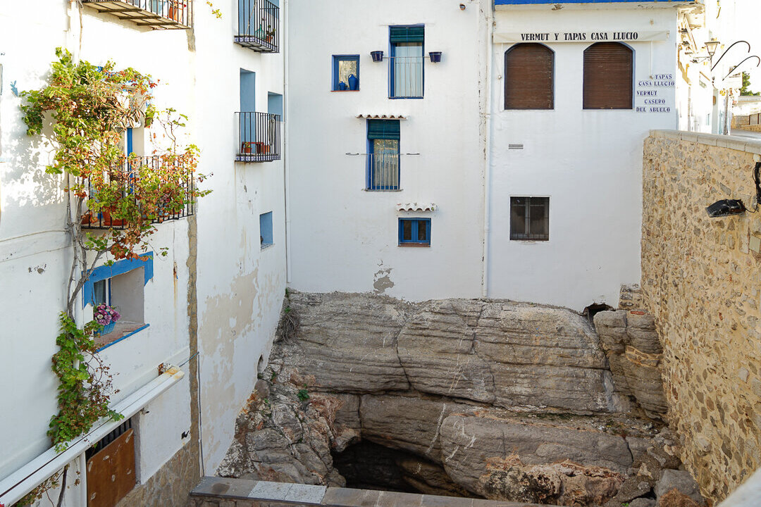 View of a blowhole between buildings in Peniscola, Spain