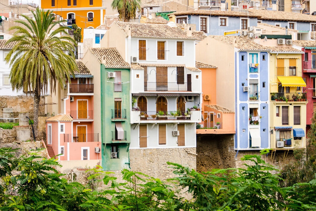 Colorful buildings of different heights in Villajoyosa, Spain.