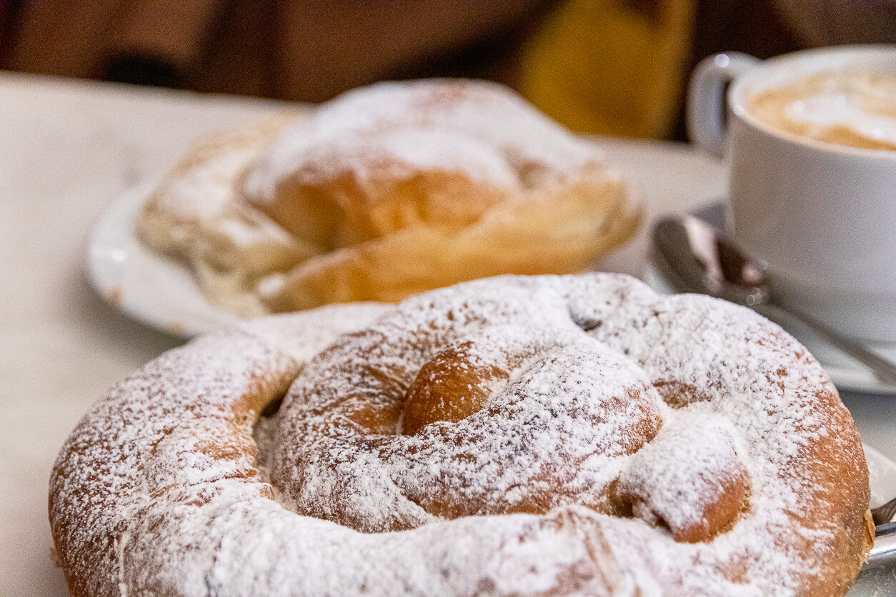 Typical Majorcan sweet pastry, spiral-shaped and covered with powdered sugar. Balearic Islands, Spain.
