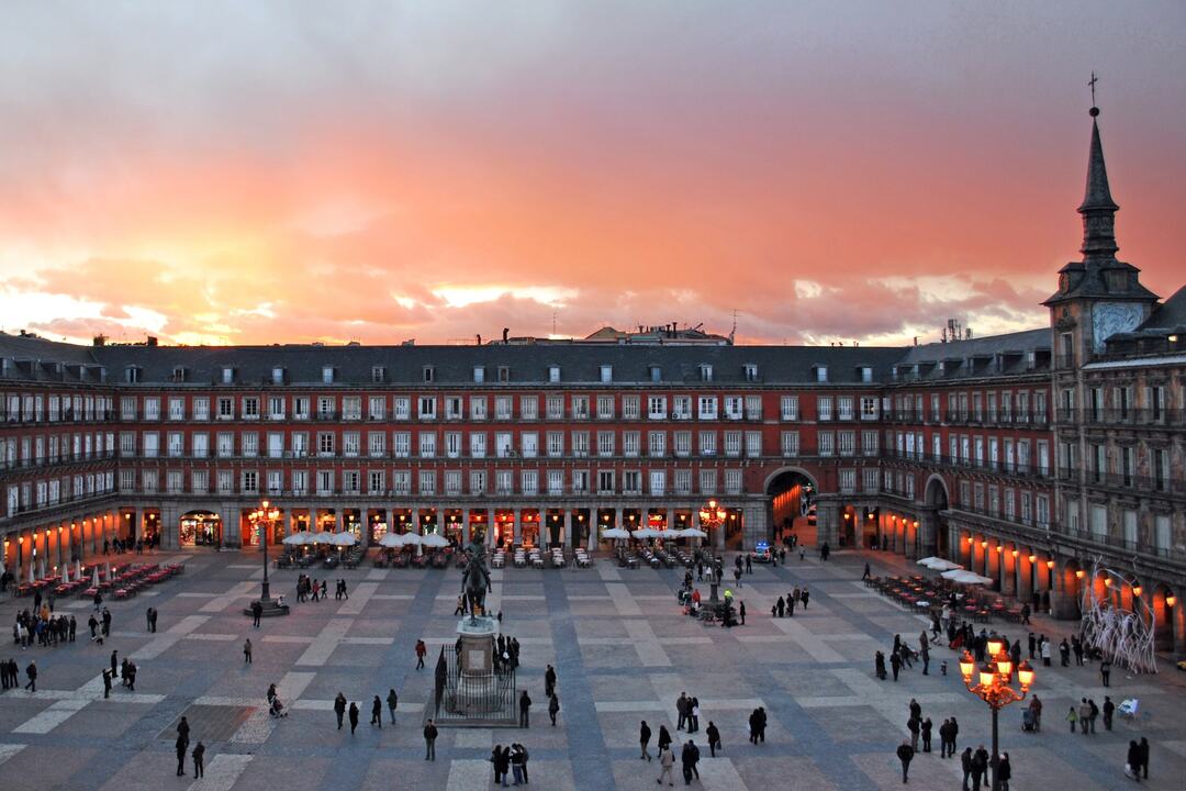 Big square with beautiful buildings and enchanting architectural details in Madrid, Spain.