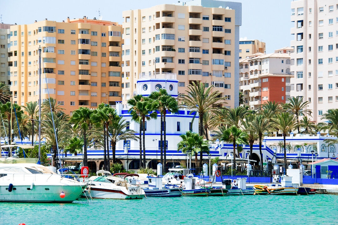 View of yachts and high buildings in the background at the port of Estepona, Andalusia, Spain.